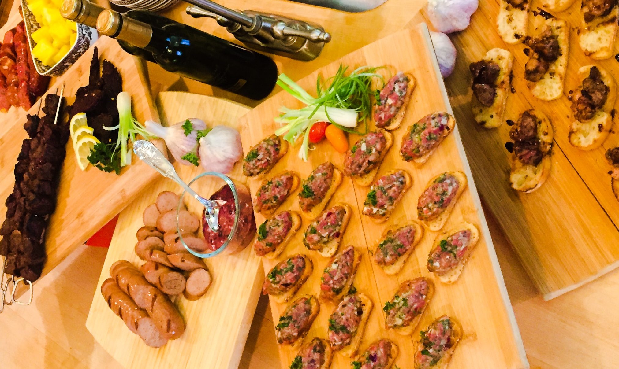 From left to right: Jalapeño Cheese Venison Sausage, Wagyu Beef Jerky, Korean Beef Satay Skewers, Foie Gras Bratwurst, Wagyu Beef Tartare, Sonoma Foie Gras on Crostini with Balsamic Fig Glaze