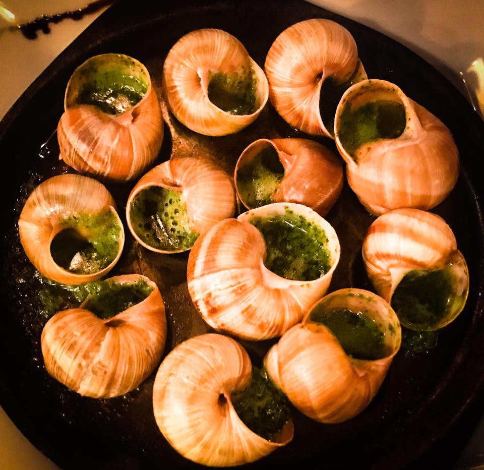 Escargot, plump and tender in a most delicious garlic herb butter